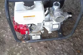 Water pump with suction and outlet hose honda